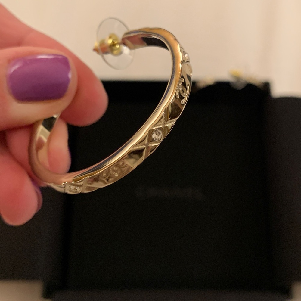 Authentic gorgeous 2 inches golden Chanel hoops with CC logo and crystals.Limit